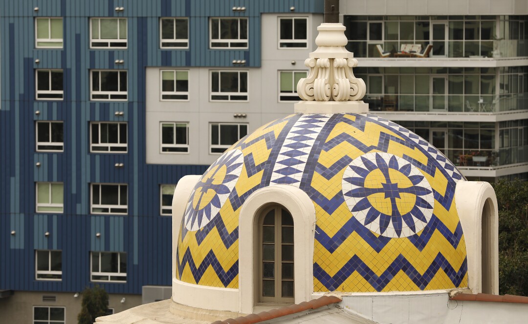 A blue and yellow tiled cupola in a geometric pattern