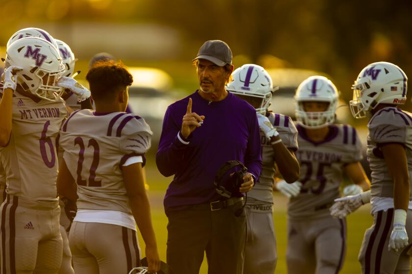 BONHAM, TEX. - AUGUST 30: Former Baylor Head Coach and current Mount Vernon High School Tigers Head Coach Art Briles and the Mount Vernon Tigers on the sidelines before the start of a game against the Bonham Warriors at Warrior Stadium at Bonham High School on Friday, Aug. 30, 2019 in Bonham, Tex. (Kent Nishimura / Los Angeles Times)