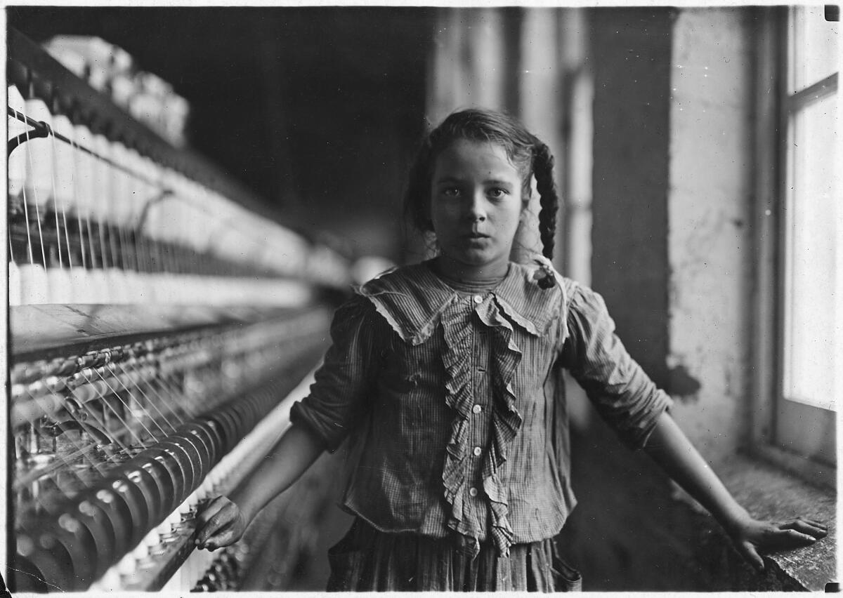 A little girl in a mill in 1908.