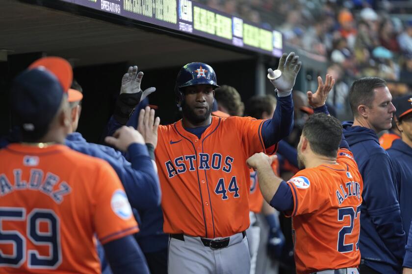 Houston Astros' Yordan Alvarez (44) celebrates after scoring against the Detroit Tigers in the eighth inning of a baseball game, Friday, May 10, 2024, in Detroit. (AP Photo/Paul Sancya)