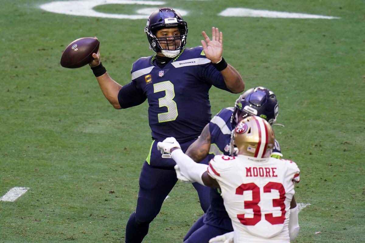 Seattle Seahawks quarterback Russell Wilson throws against the San Francisco 49ers.