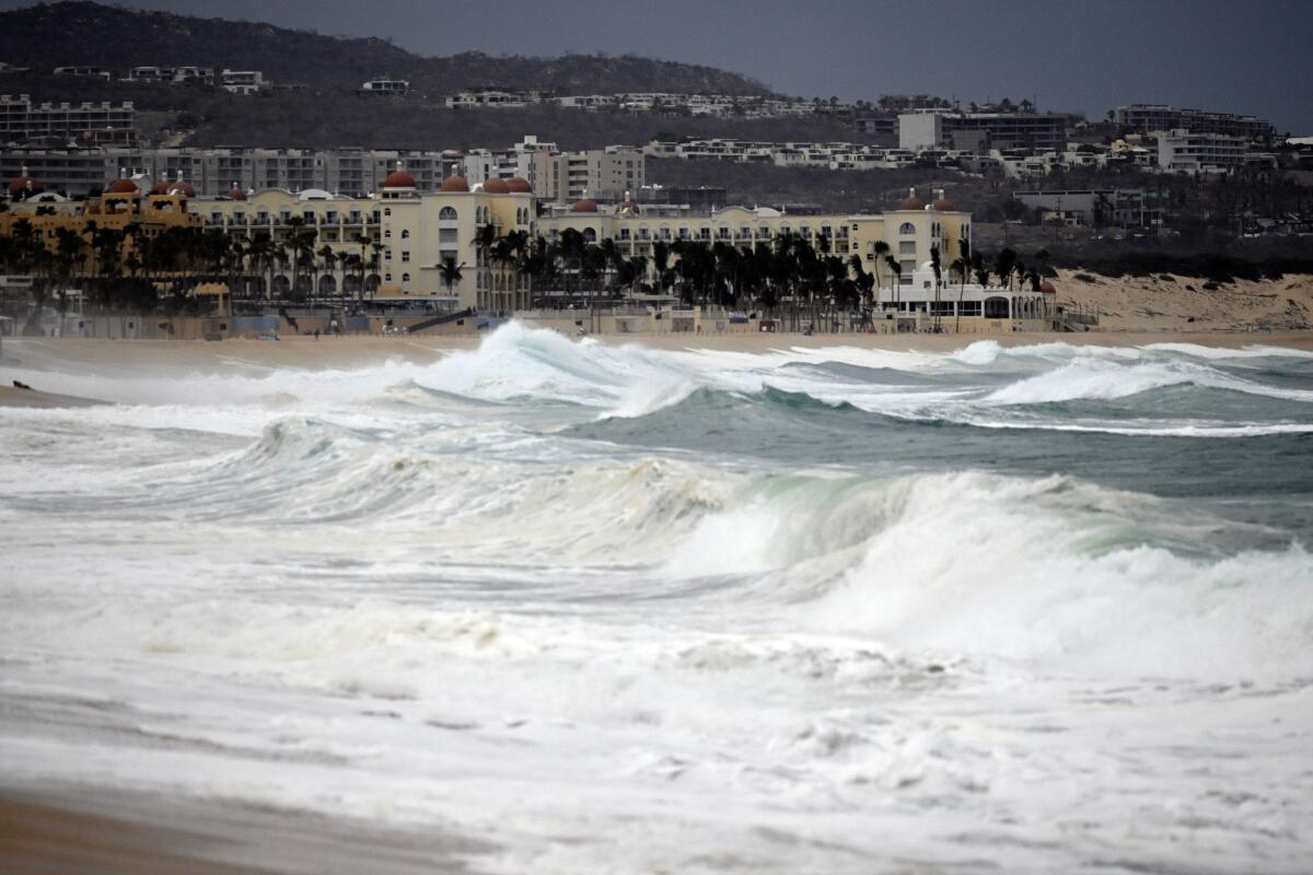 Medano beach in Los Cabos, Mexico, shows roiled surf ahead of Hurricane Hilary.
