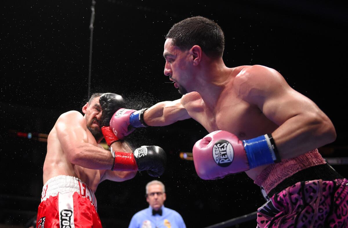 Danny Garcia, right, lands a right to the head of Robert Guerrero during their WBC welterweight title fight Saturday night at Staples Center.