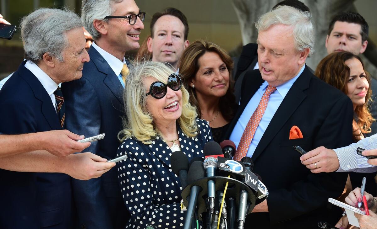 Shelly Sterling reacts outside of the courthouse in Los Angeles after a judge ruled in her favor on her right to sell the Clippers for $2 billion to Steve Ballmer.