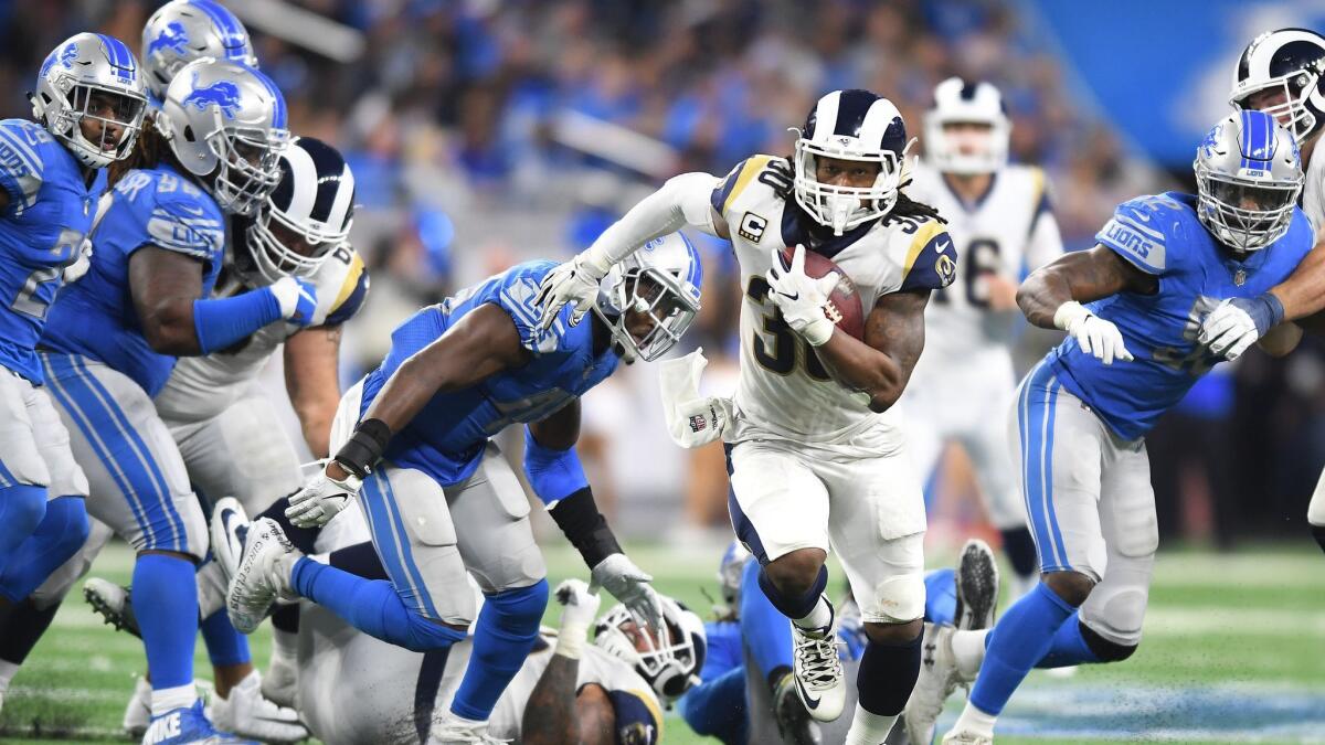 Rams running back Todd Gurley breaks free from the Lions defense.