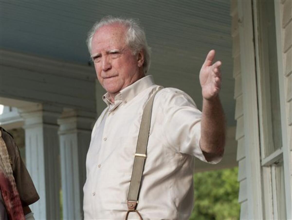 In this image released by AMC, actor Scott Wilson appears in a scene from the second season of the AMC original series, "The Walking Dead," in Senoia, Ga. Peachtree City police arrested 70-year-old Scott Wilson on Aug. 18, 2012 after someone called 911 to report a Chrysler PT Cruiser driving erratically. On the AMC drama, Wilson plays a farmer and recovering alcoholic who's part of a band of survivors after a zombie apocalypse. (AP Photo/AMC, Gene Page)