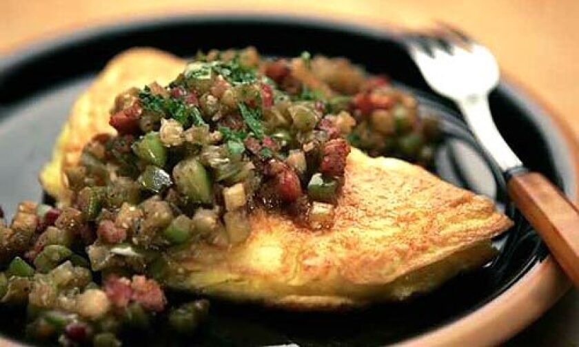 Make a variation on classic chile verde by using tomatillos in a sauce for a fluffy omelet made with panela cheese (a fresh Mexican cheese that softens to rich creaminess when heated).