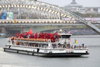 PARIS, FRANCE JULY 26, 2024 - Team Canada travels by boat along the Seine river.