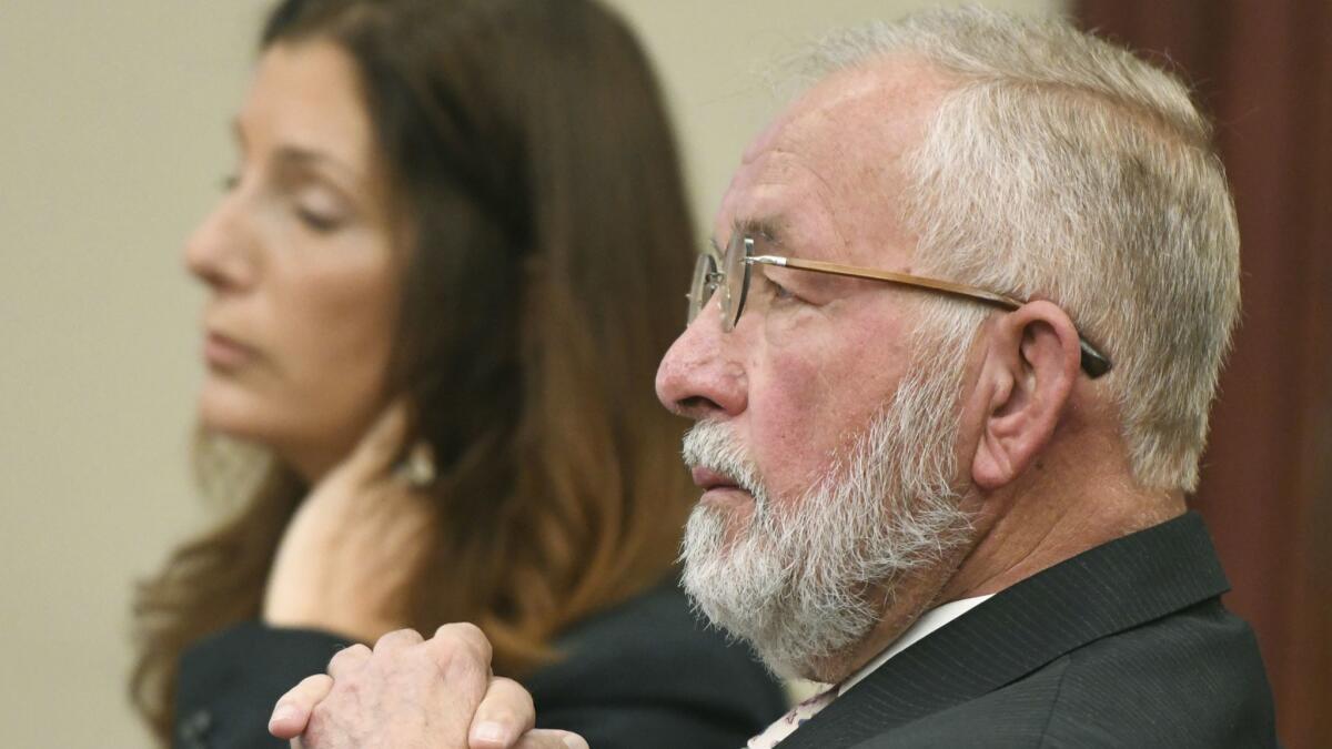 William Strampel listens during closing arguments in his trial June 11 in Lansing, Mich.