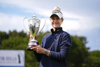 Nelly Korda holds up the trophy after winning the final round of LPGA's Fir Hills Seri Pak Championship.