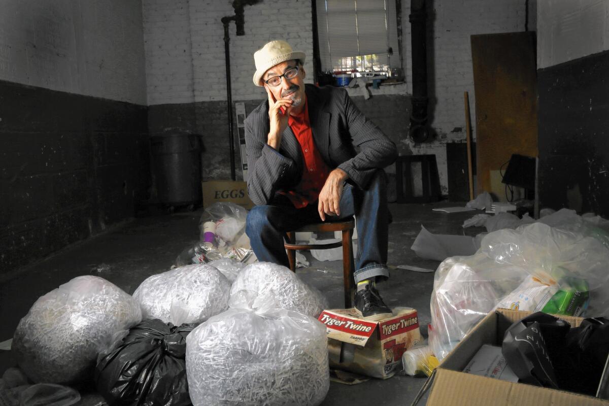 Author Barry Yourgrau at his apartment building in Queens, New York. He would photograph the items he threw away in this garbage area in the basement of his building.
