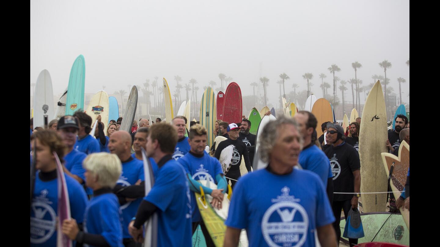 Photo Gallery: 500 surfers paddle out for a record-setting attempt to promote Huntington Beach for the 2024 Olympics