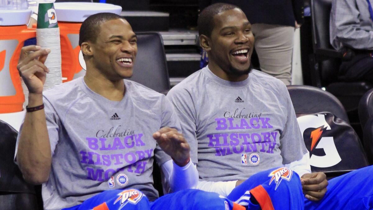Oklahoma City Thunder guard Russell Westbrook, left, and forward Kevin Durant, right, laugh before the start of a game against the New Orleans Pelicans on Feb. 6. Have injuries masked Oklahoma City's competitiveness?
