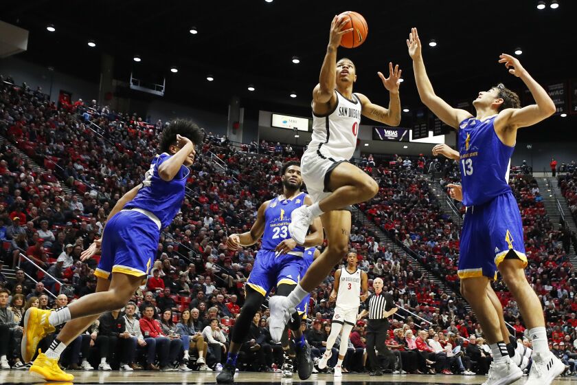 San Diego, CA - January 28: San Diego State's Keshad Johnson scores on a revers against San Jose State on Saturday, January 28, 2023 in San Diego, CA. (K.C. Alfred / The San Diego Union-Tribune)