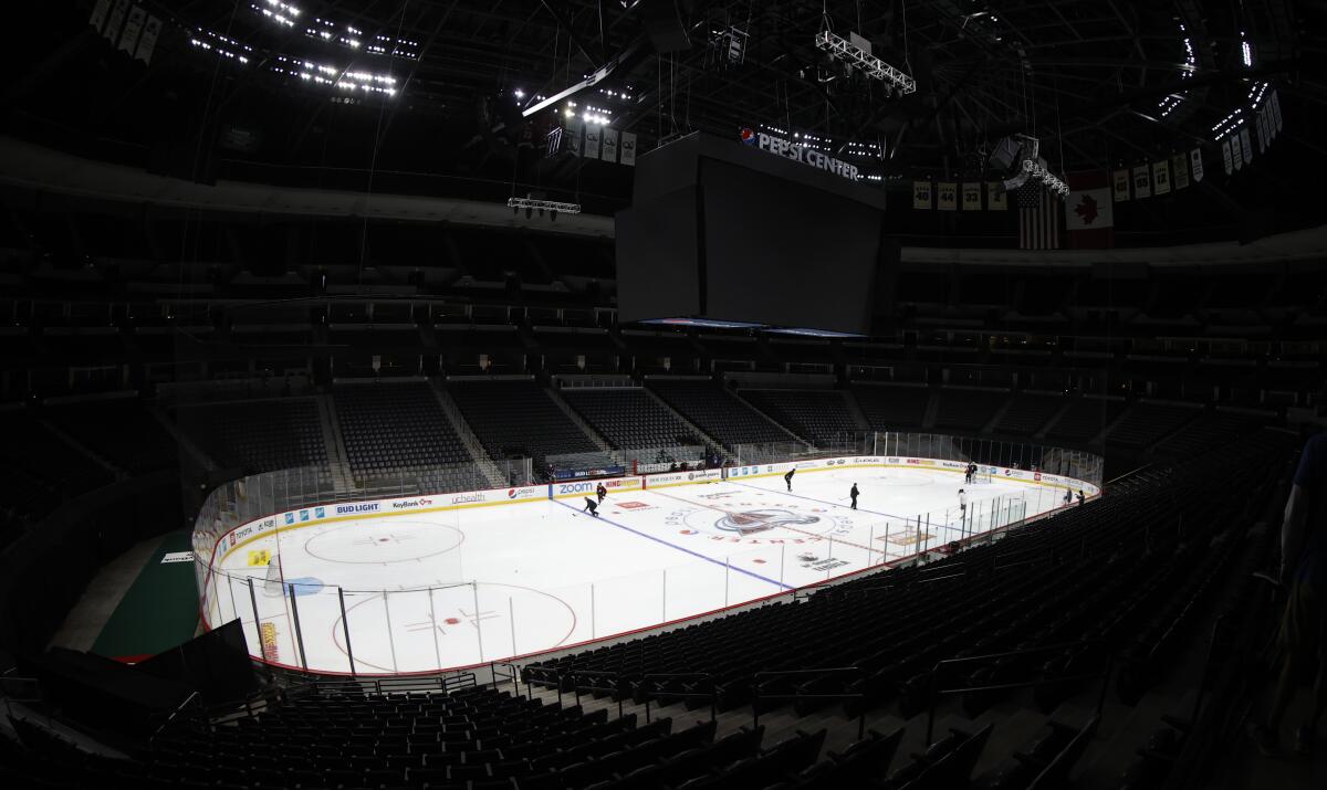 Colorado Avalanche players take part in drills during the team's practice in an empty Pepsi Center on Monday in Denver.