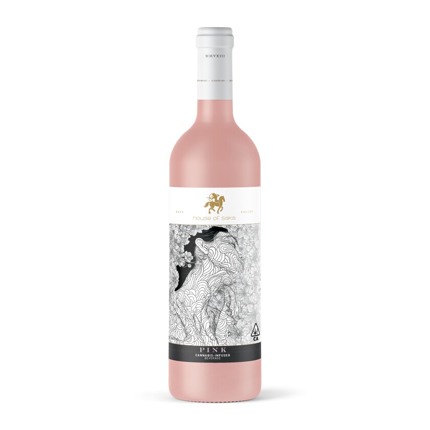 A pink wine bottle with a white and black label