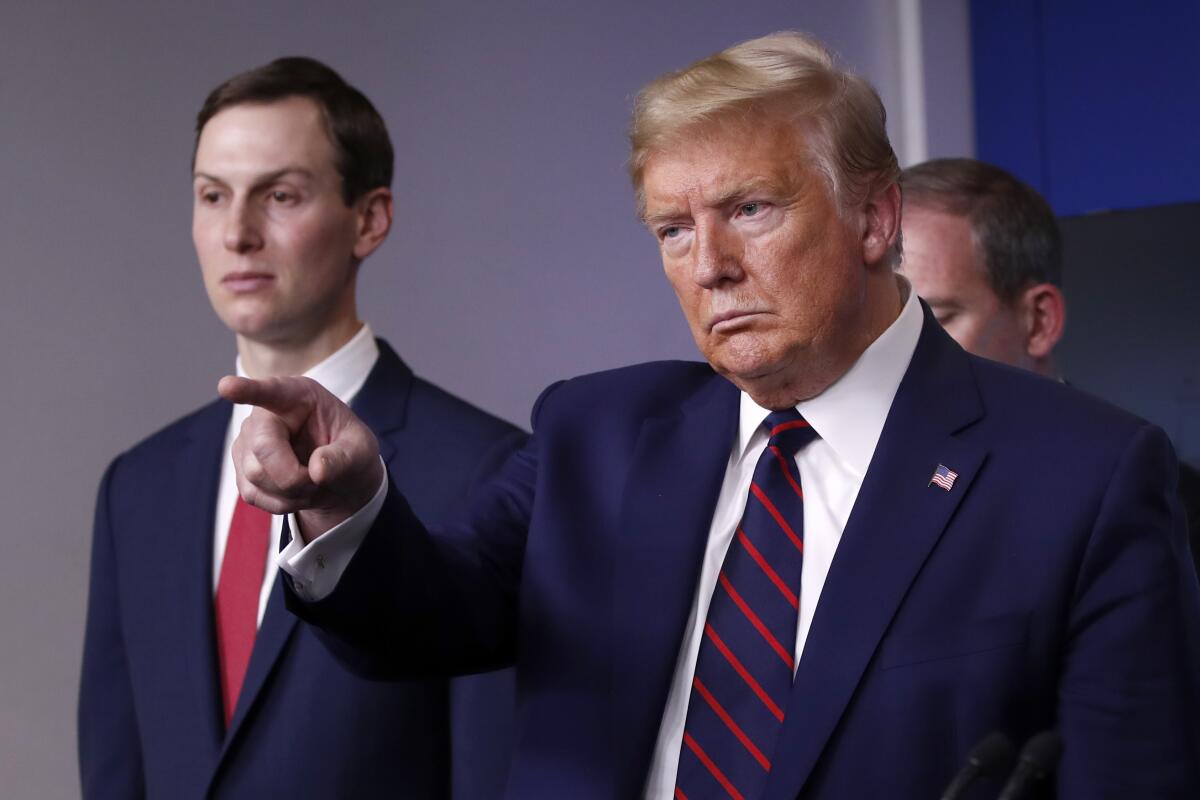 President Trump points to a reporter to ask a question during a news conference on April 2.