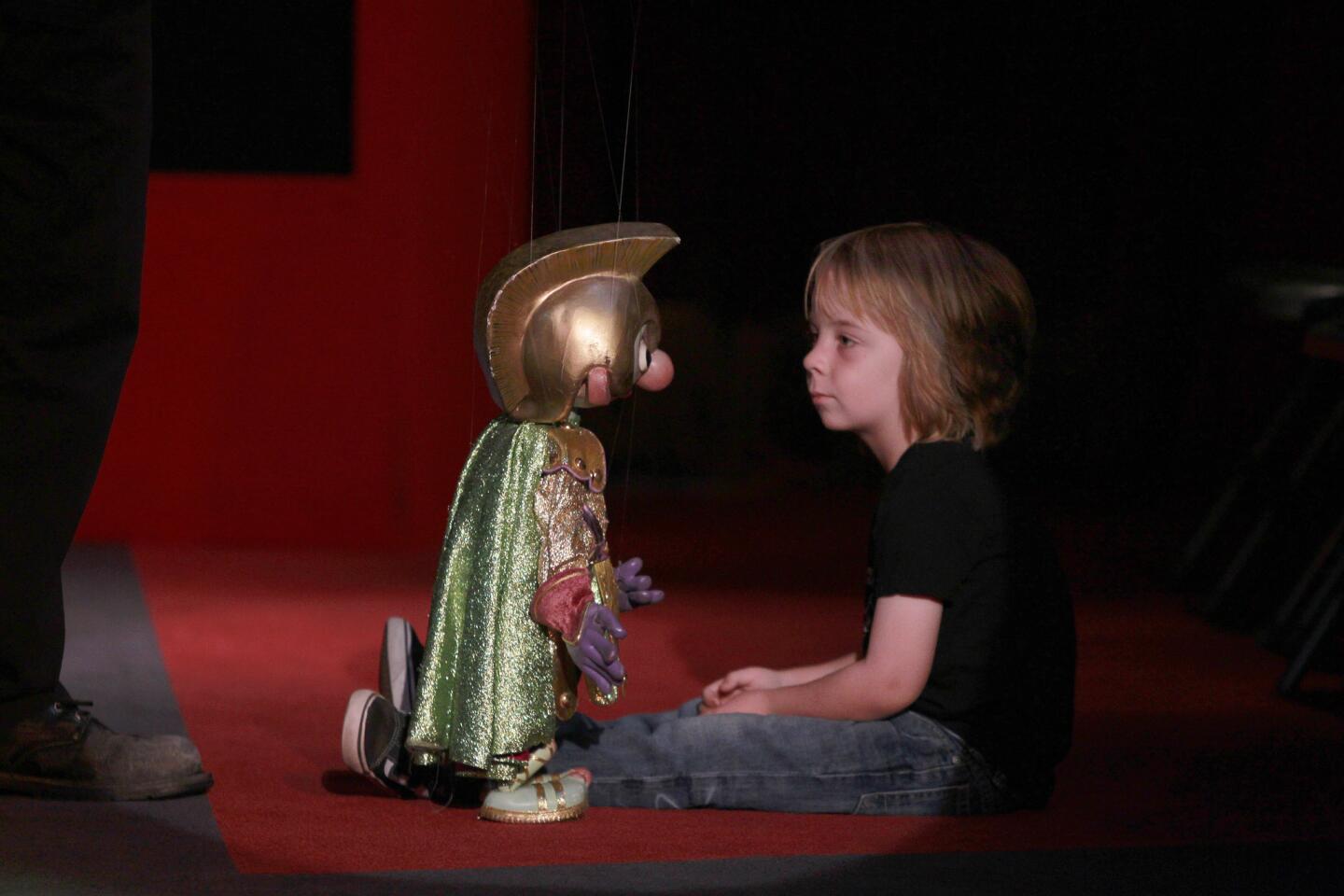 Shane McCullough, 4, comes face to face with a puppet during a show at the Bob Baker Marionette Theater in Echo Park.