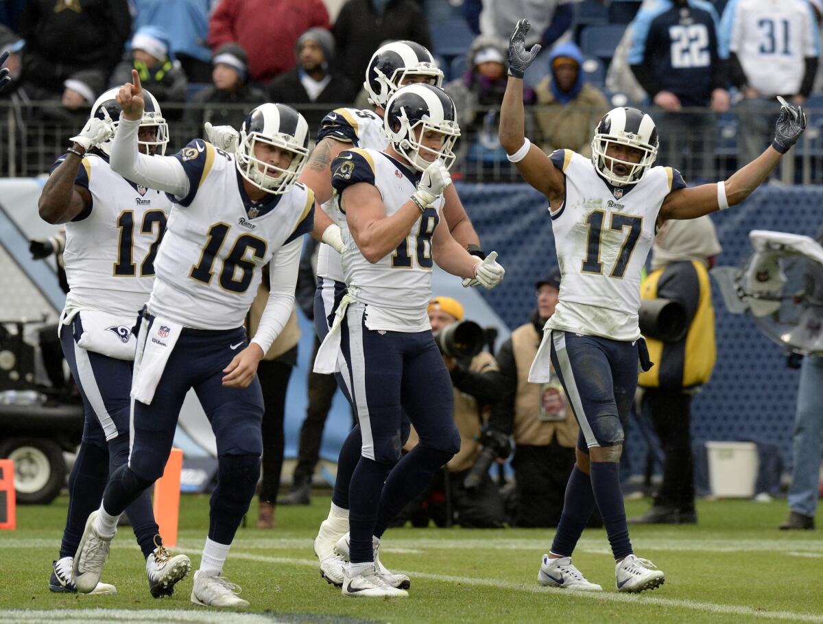 FILE - In this Dec. 24, 2017, file photo, Los Angeles Rams quarterback Jared Goff (16) and celebrates with wide receiver Cooper Kupp (18) after Kupp scored a touchdown against the Tennessee Titans in the second half of an NFL football game in Nashville, Tenn. The Rams, who are in the playoffs for the first time since 2004, host the Falcons on Saturday in the showcase of wild-card weekend.