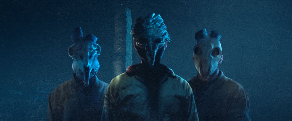 Three people wearing animal masks in the movie "Barbarians."