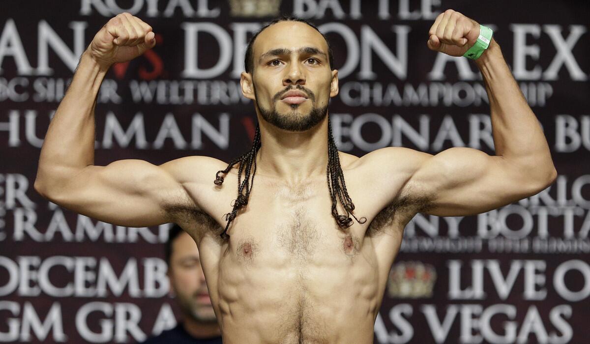 Keith Thurman flexes during a previous weigh-in in Las Vegas on Dec. 12, 2014. Thurman and Shawn Porter will meet Saturday at Barclays Center in Brooklyn, N.Y., for Thurman's WBA welterweight title.
