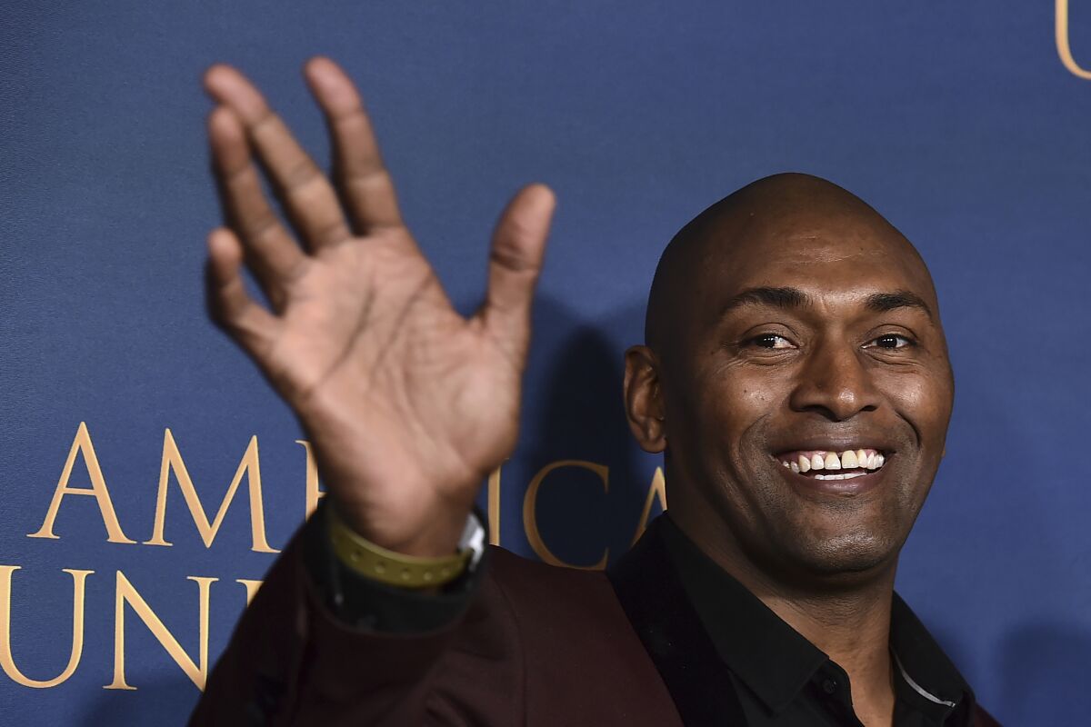 FILE - Metta World Peace arrives at the premiere of "American Underdog" on Dec. 15, 2021, at the TCL Chinese Theatre in Los Angeles. Baron Davis, Metta World Peace and Shane Battier have spent time in Asia helping build the profile of basketball, and their base of fans. (Photo by Jordan Strauss/Invision/AP, File)