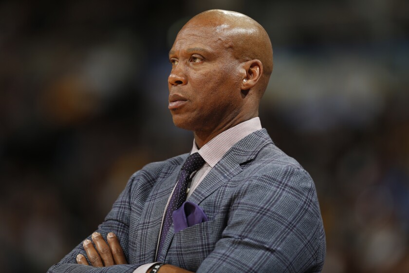 Former Lakers coach Byron Scott watches a game against the Nuggets in Denver on March 2.