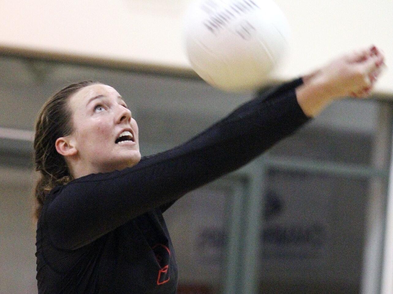 Flintridge Sacred Heart Academy's Kayla Lund reaches out to hit the ball back into play against Harvard-Westlake in a Mission League volleyball game at FSHA on Tuesday, October 27, 2015.