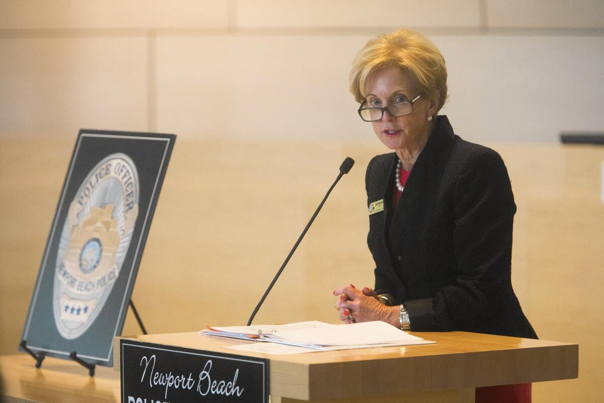 Newport Beach Mayor Diane Dixon addresses the audience during the swearing in ceremony of Police Chief Jon Lewis on Tuesday afternoon.