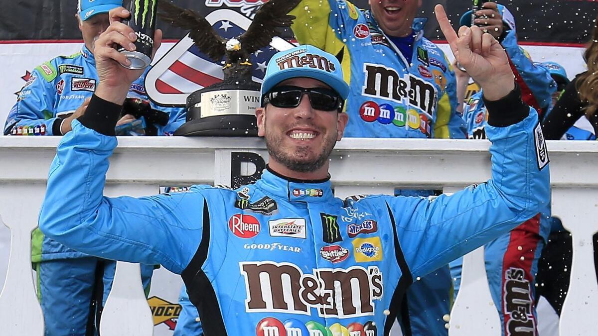 Kyle Busch celebrates after winning a NASCAR Cup Series race at Pocono Raceway on June 2.