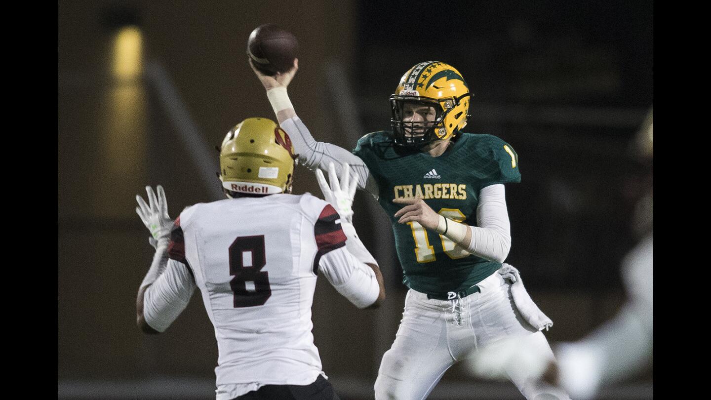 Edison's Griffin O'connor throws under pressure from Oak Christian's Kayvon Thibodeaux during a CIF Southern Section Division 2 quarterfinals playoff game on Friday, November 17.