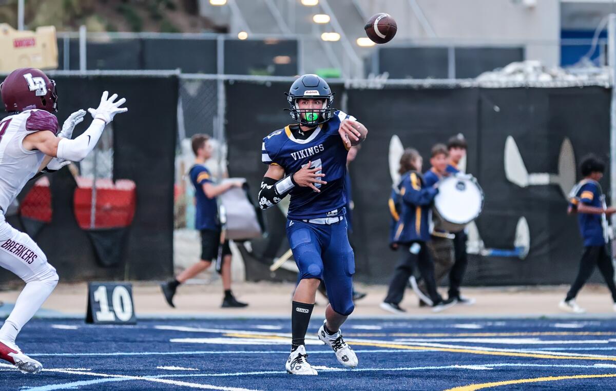 Quarterback Wyatt Brown throws a pass while playing last season for Santa Monica High.