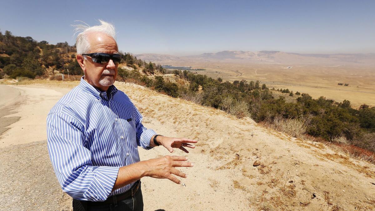 Barry Zoeller, vice president of corporate communications for Tejon Ranch Co., standing on a bluff overlooking the Centennial site on Tejon Ranch.