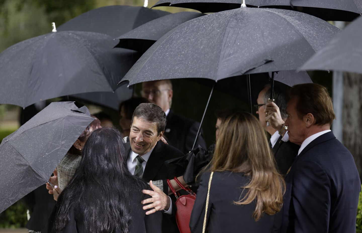 Ron Reagan, left, greets mourners at his mother Nancy Reagan's funeral at the Ronald Reagan Presidential Library in Simi Valley.