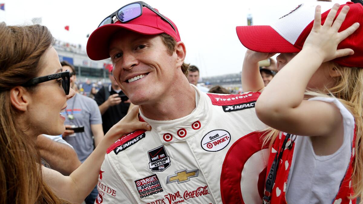 Scott Dixon celebrates Sunday with wife Emma, left, and daughter Tilly, 3, after qualifying on the pole for the Indianapolis 500.