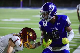 Palisades running back Harrison Carter is shoved out of bounds by Roosevelt's Amixtili Lopez during a game on August 29, 2024.