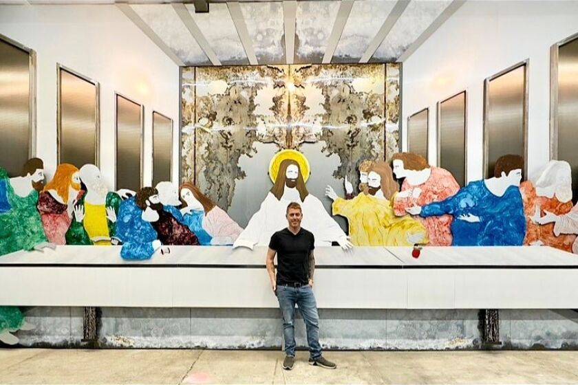 Michael Leaf stands by his monumental metal artwork of "The Last Supper." It matches the size of da Vinci's masterpiece.