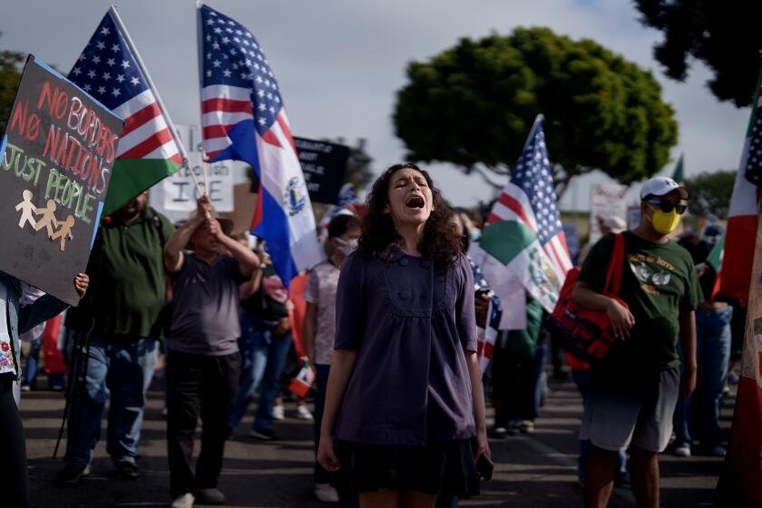 OXNARD, CALIFORNIA - JULY 11: People attend a rally and march on July 11, 2025 in Oxnard, California. The rally and march came a day after around 200 people were detained by federal officers during a raid at a cannabis farm in nearby Camarillo. (Photo by Eric Thayer/Getty Images)