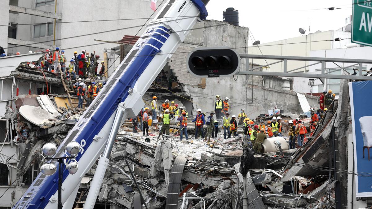 The search continues for victims buried under the rubble of a fallen office building along Calle Alvaro Obregon in La Condesa neighborhood of Mexico City.