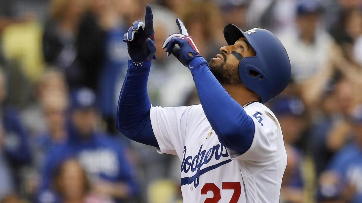 Dodgers left fielder Matt Kemp gestures after hitting a home run against the San Francisco Giants on June 16.