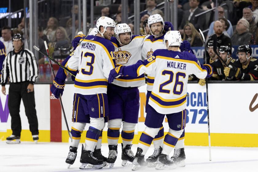 The Kings celebrate after Kevin Fiala, middle left, scored a first-period goal against the Golden Knights on Jan. 7, 2023.