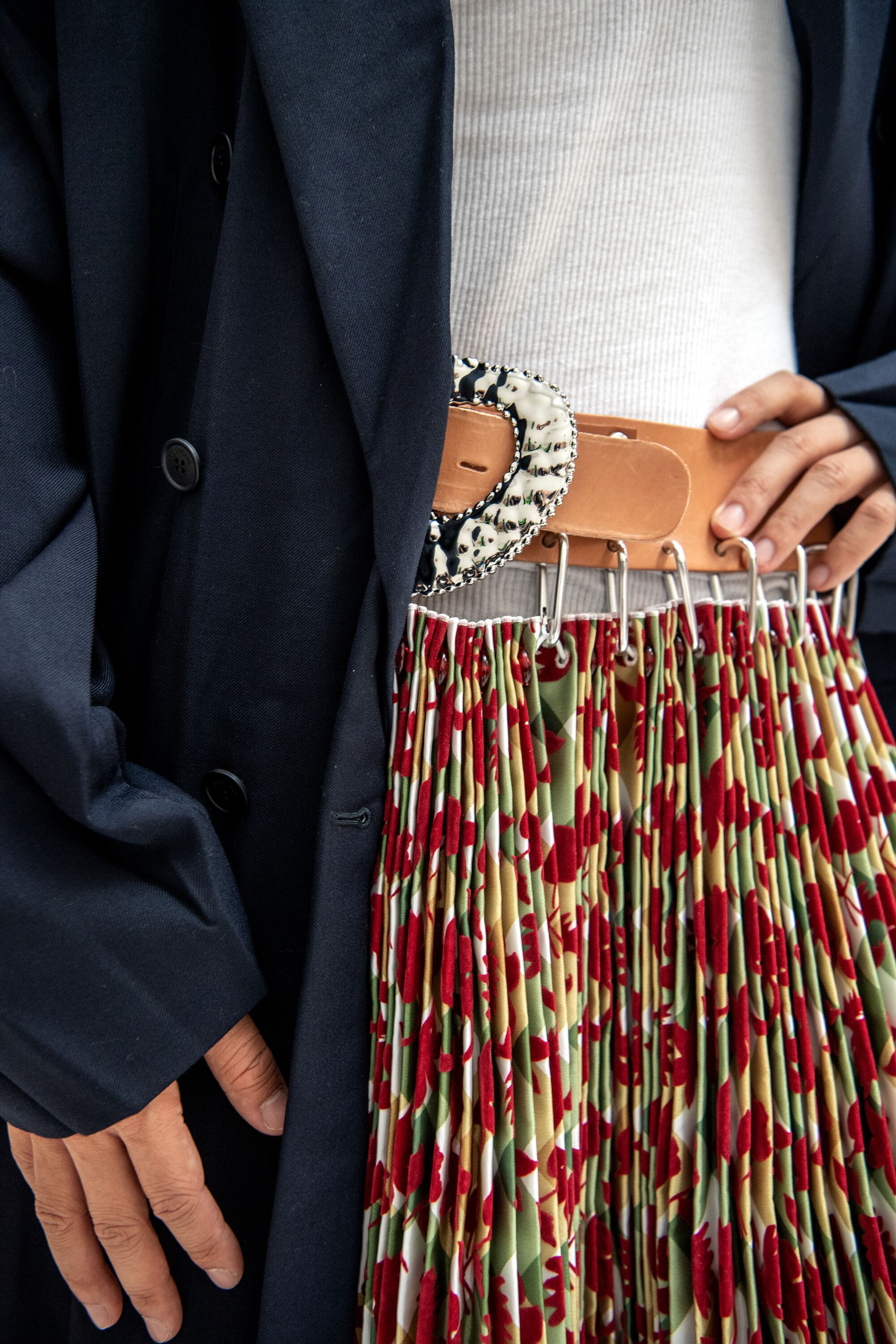 A closeup detail of Chen's pleated Chopova Lowena skirt.