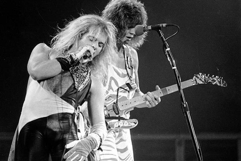 In this Oct. 19, 1982 file photo, lead singer David Lee Roth, left, and lead guitarist Eddie Van Halen perform at the Spectrum in Philadelphia on Oct. 19, 1982.