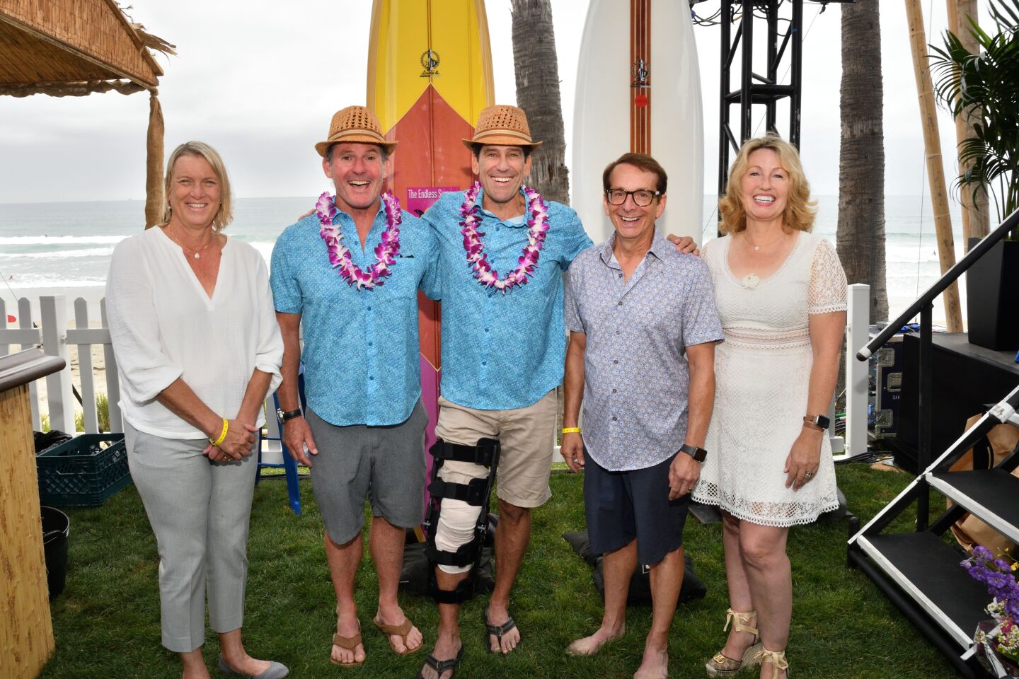 UC San Diego Health Chief Executive Patty Maysent, Luau & Legends of Surfing co-chairmen Jay Hagan and Dr. John Dobak, Rich Heyman and Moores Cancer Center Deputy Director Dr. Catriona Jamieson