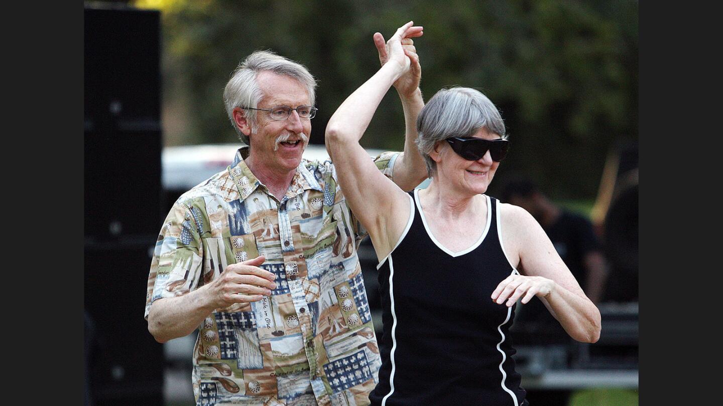 Conrad Henning, of Pasadena, dances with Cindy Ewing, of La Crescenta, dance on the dancefloor at the Summer Concerts in the Park series featuring the Verdugo Swing Society on Wednesday, July 5, 2017. The couple are friends who met at the Pasadena Ballroom Dance Association. The series, organized by Glendale Community Services and Parks will be on Wednesdays until August 9 featuring different bands. More information is available at www.glendaleca.gov/parks.