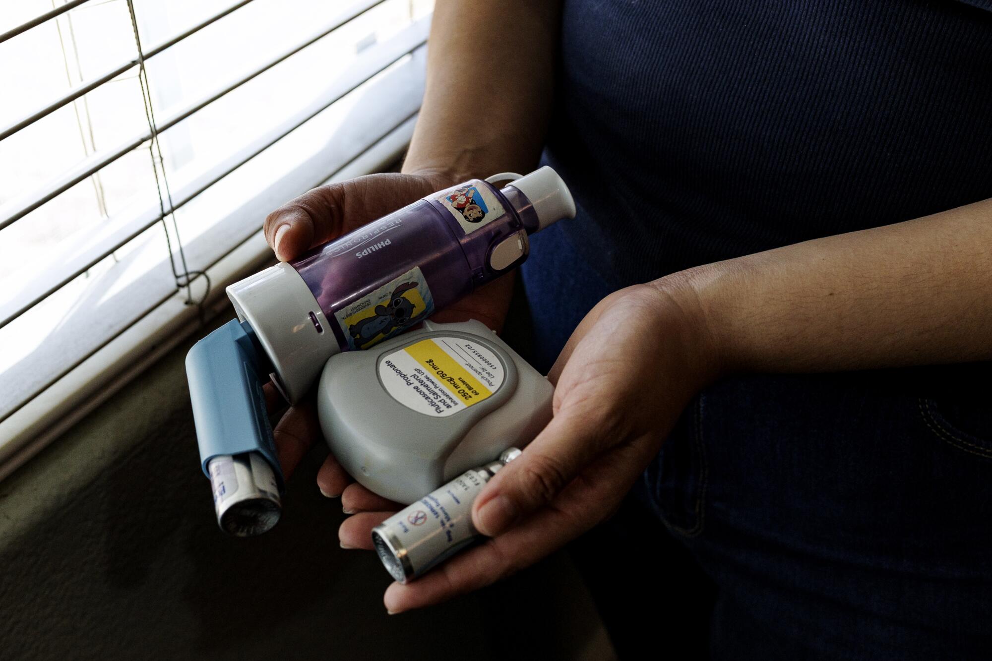 Imperial resident Fernanda Camarillo holds some of her medications.