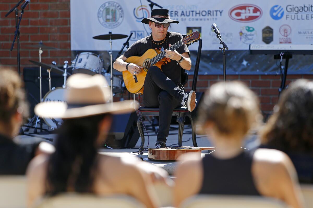 Spanish guitar soloist Michael Jost performs live during the Day of Music Fullerton festival at Downtown Fullerton Plaza.