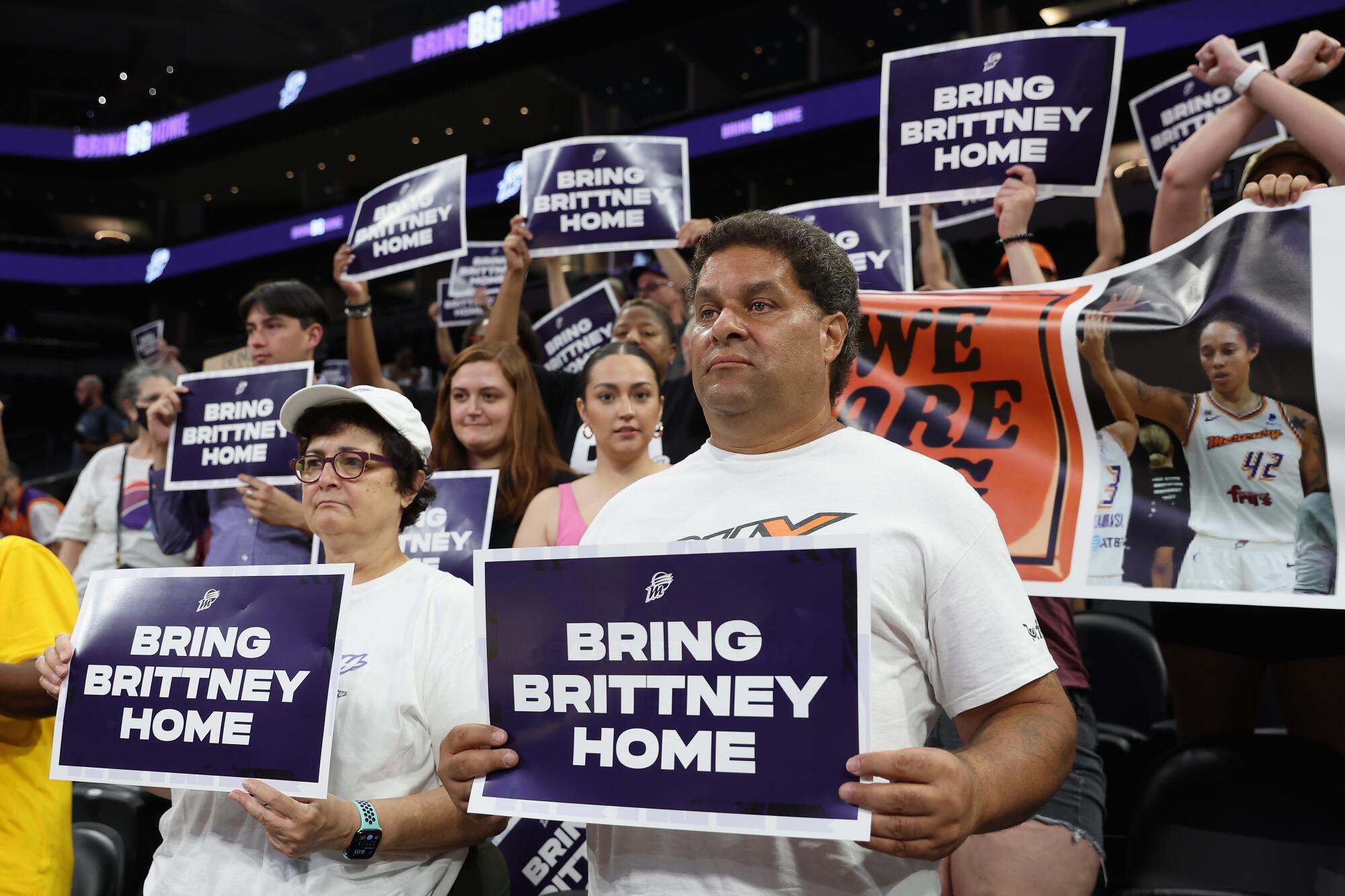 Supporters hold up signs reading "Bring Brittney Home" during a rally to support the release of Britney Griner.