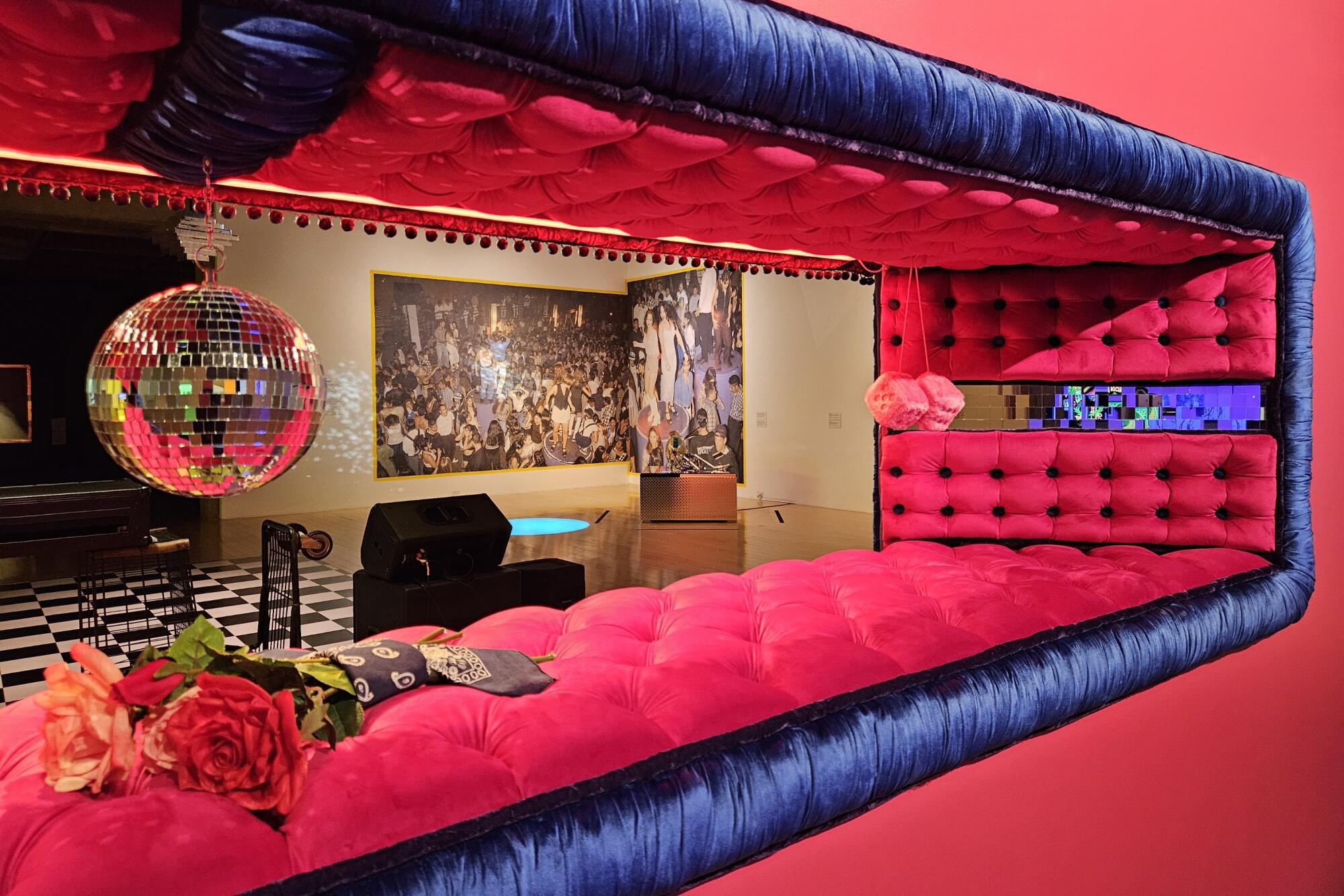 A view into a dance gallery is framed by Guadalupe Rosales' lowrider-inspired "Concourse/C3" installation.