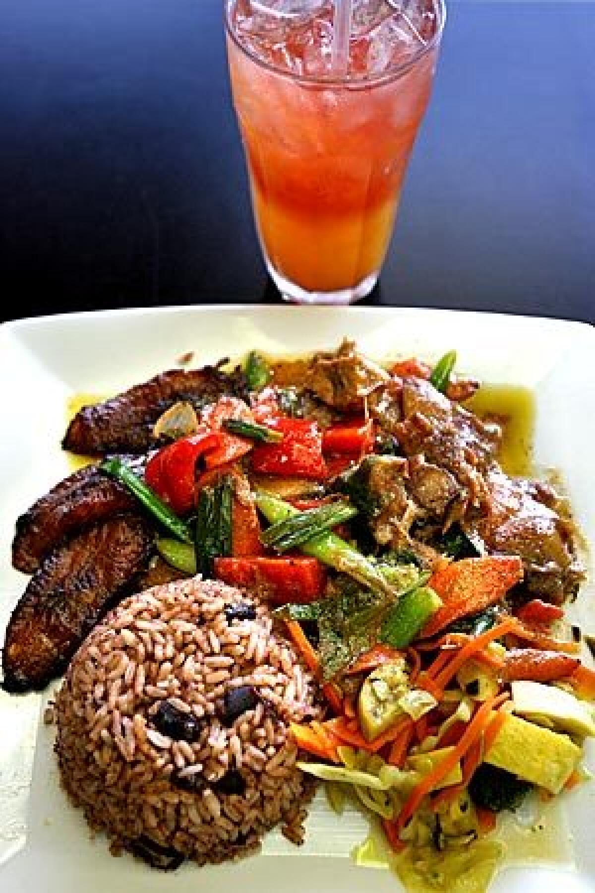 Tropical chicken -- with guava, ginger and pineapple in a sauce served with rice and peas and fried plantains -- is on the menu at Sattdown Jamaican Grill in Studio City.